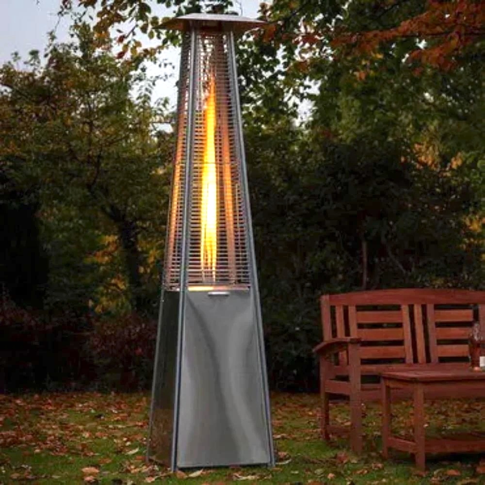 A tall, metal heating lamp with a flame flickering inside